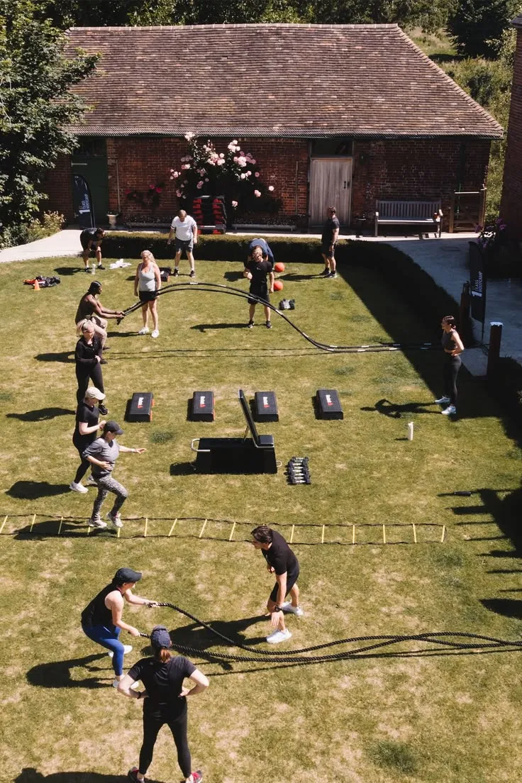 Athlete performing outdoor bodyweight movement on concrete surface